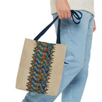 Boho Geometric Everyday Patterned Canvas Tote Bag With Reinforced Handles, 3 Sizes, carried with navy handles beside casual blue jeans, showing the structured beige body and geometric print. Patterned canvas tote with art tote, beige bag, bohemian bag, boho tote, canvas tote, eco shopping, everyday tote, gift for her, market bag, neutral tote, printed tote, summer tote, and tribal tote styling.