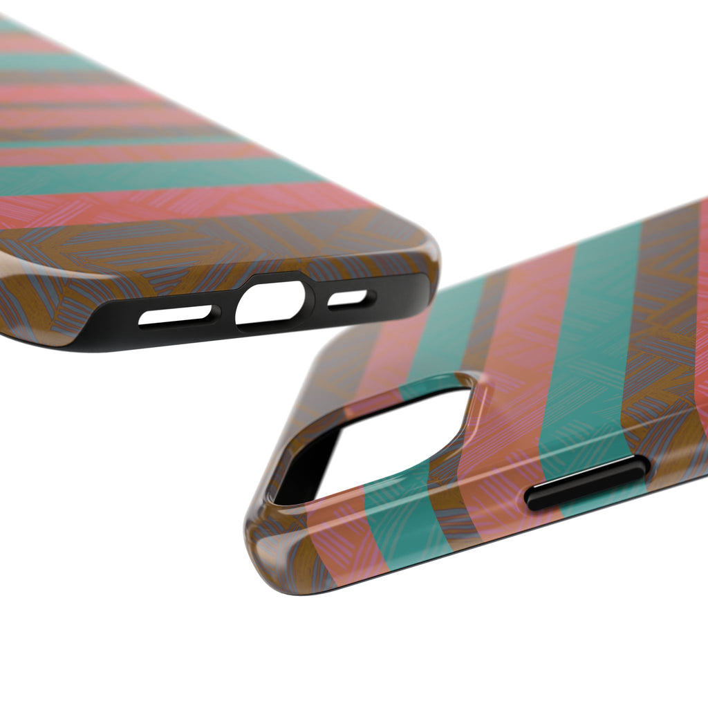 Striped Tribal Tough Phone Case — Retro Teal & Coral Protective Cover displayed on a wood desk beside a laptop and earbuds as a fractyl shockproof iphone 17 pro case