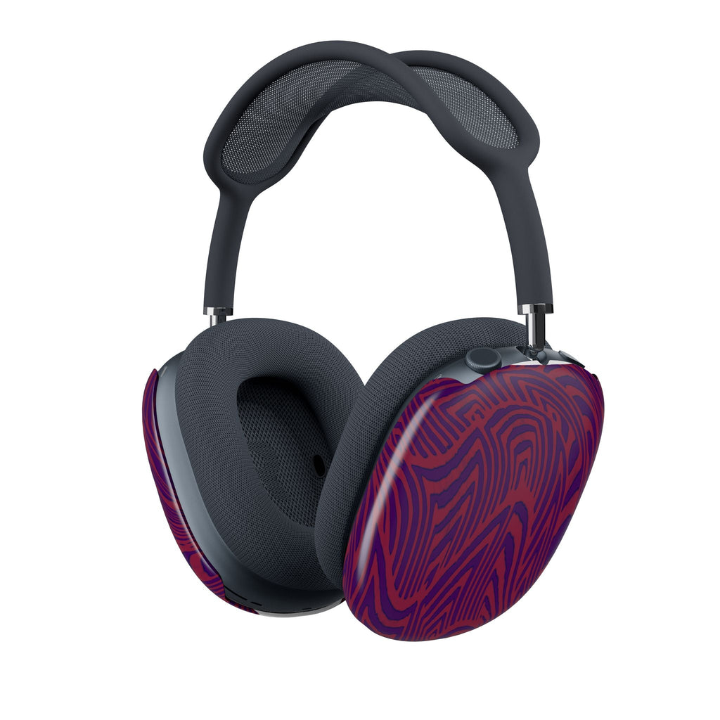 User wearing AirPods Max with the striking purple-red swirl snap-on cover, highlighting how the unique design elevates everyday audio accessories.