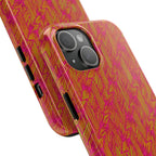 Tough Phone Case — Vibrant Tropical Herringbone Pattern, impact resistant iphone 17 case shown on a desk beside a laptop and notebook