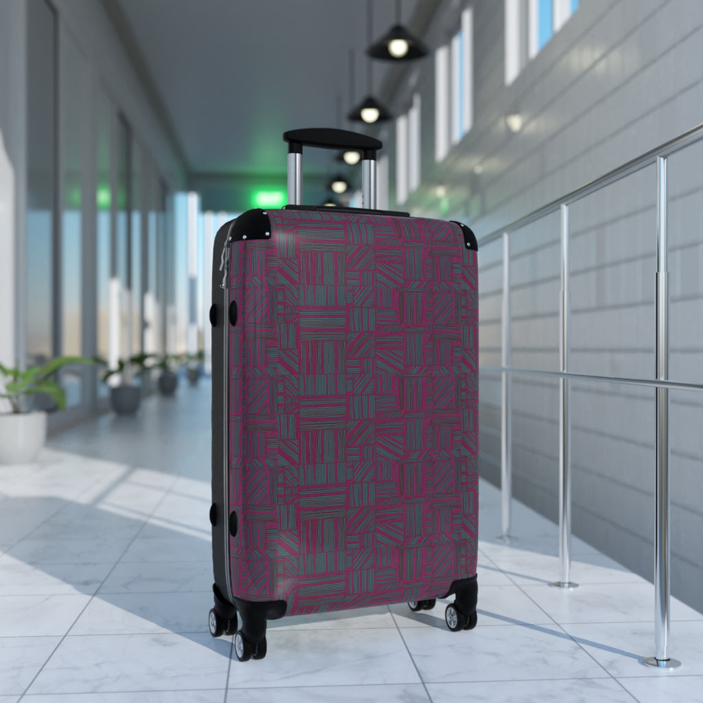 Geometric Plum Carry-On Suitcase – Stylish Patterned Rolling Luggage, angled airport view of an expandable carry on suitcase with vibrant geometric plum print and easy-glide spinner wheels.