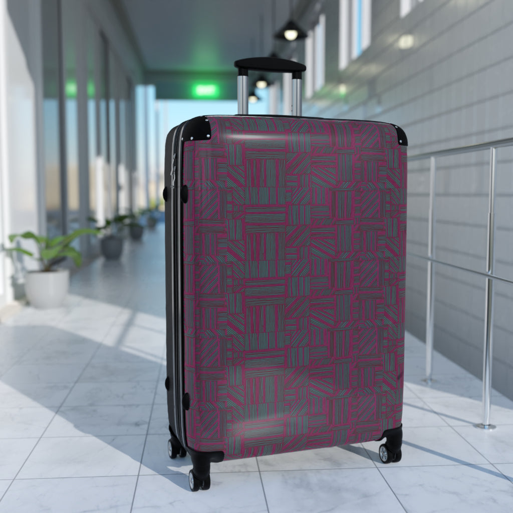 Geometric Plum Carry-On Suitcase – Stylish Patterned Rolling Luggage, airport lifestyle image of an expandable carry on suitcase with a rich plum geometric pattern, telescopic handle, and 360-degree wheels.
