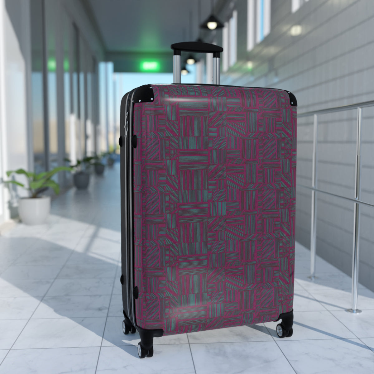 Geometric Plum Carry-On Suitcase – Stylish Patterned Rolling Luggage, airport lifestyle image of an expandable carry on suitcase with a rich plum geometric pattern, telescopic handle, and 360-degree wheels.