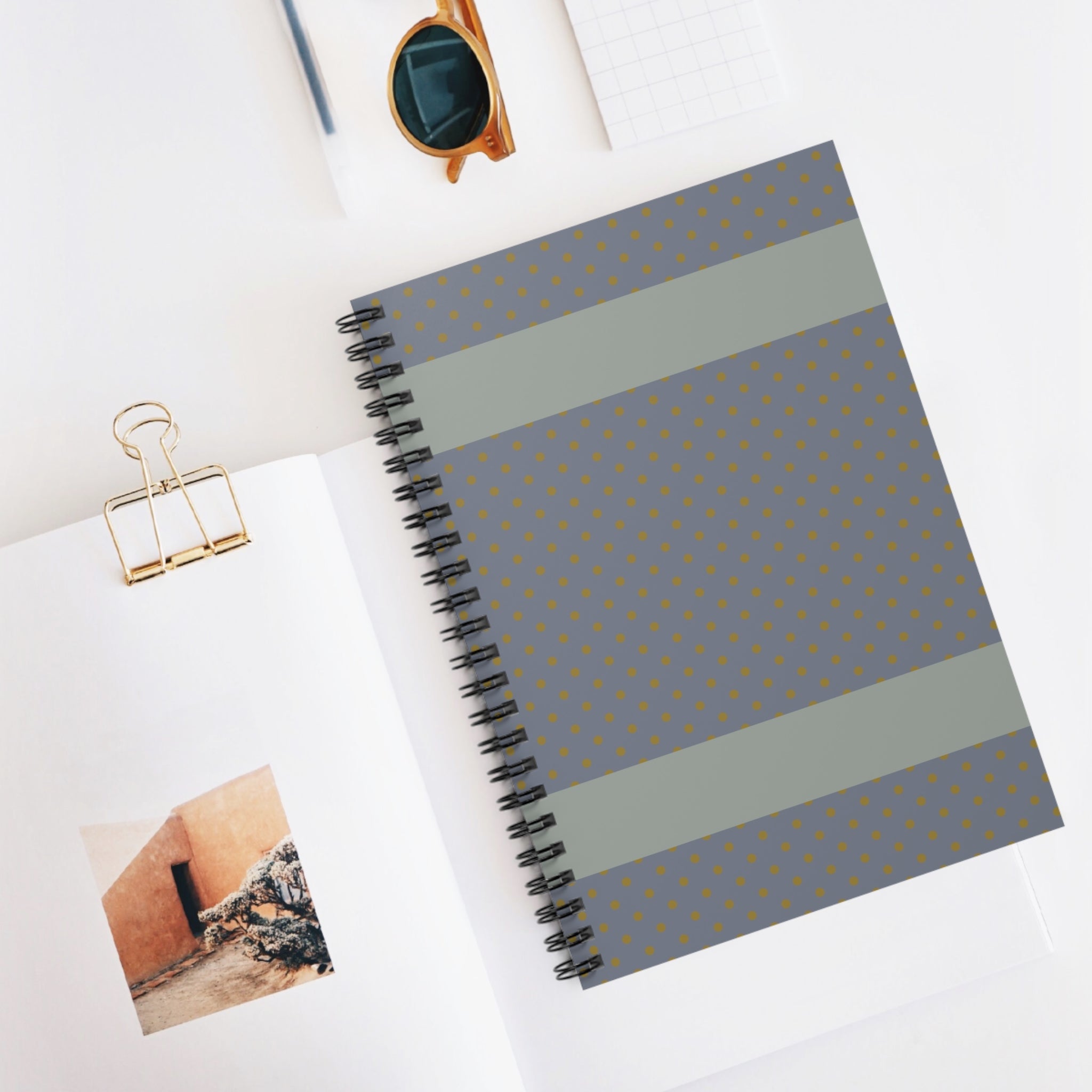 Grey Polka Dot Spiral Notebook displayed stylishly on a desk – a compact writing notebook presenting its sophisticated design with a dot pattern. This lined and minimal notebook is an ideal everyday journal or small notebook, making it a thoughtful gift for students.