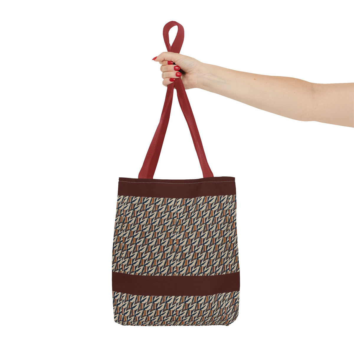 Geometric Retro Stripe Tote Bag – Vintage Brown Patterned AOP Tote held by hand with burgundy handles, large everyday cotton tote
