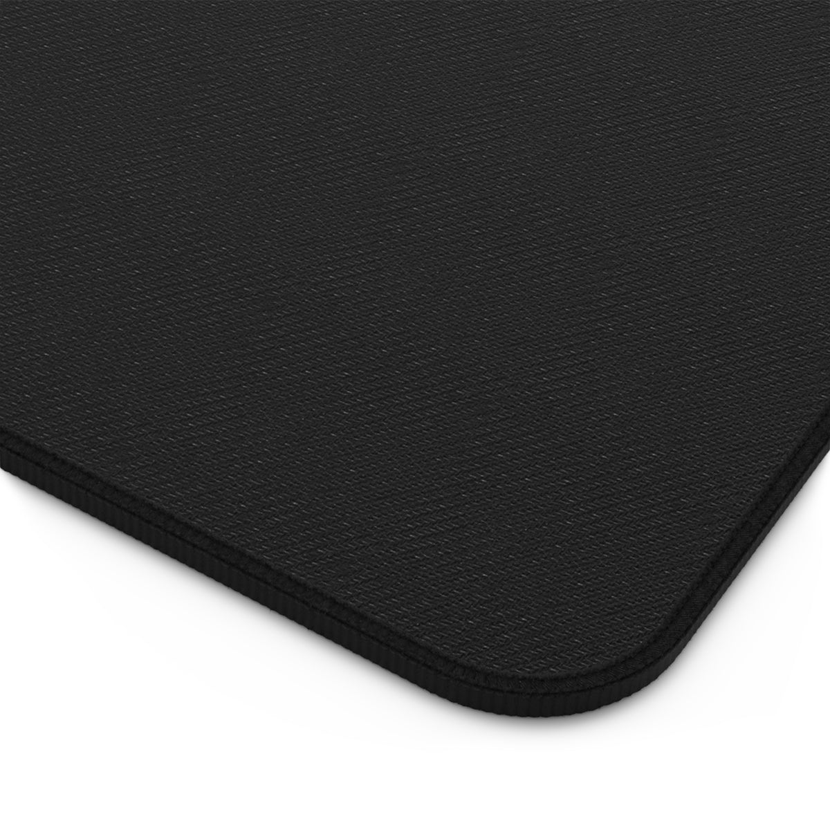 Geometric Neon Wave Desk Mat — Retro Purple & Teal Gamer Desk Pad gaming desk mat detail showing durable black anti-slip backing and rounded hemmed corner.