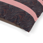 Close-up of the Marbled Charcoal Pet Bed with Pink Stripes, showcasing its soft coral-fleece top and sturdy cotton underside. This machine washable pet bed is designed for durability and comfort, making it an excellent choice for a cozy pet nook and a vibrant addition to home decor.