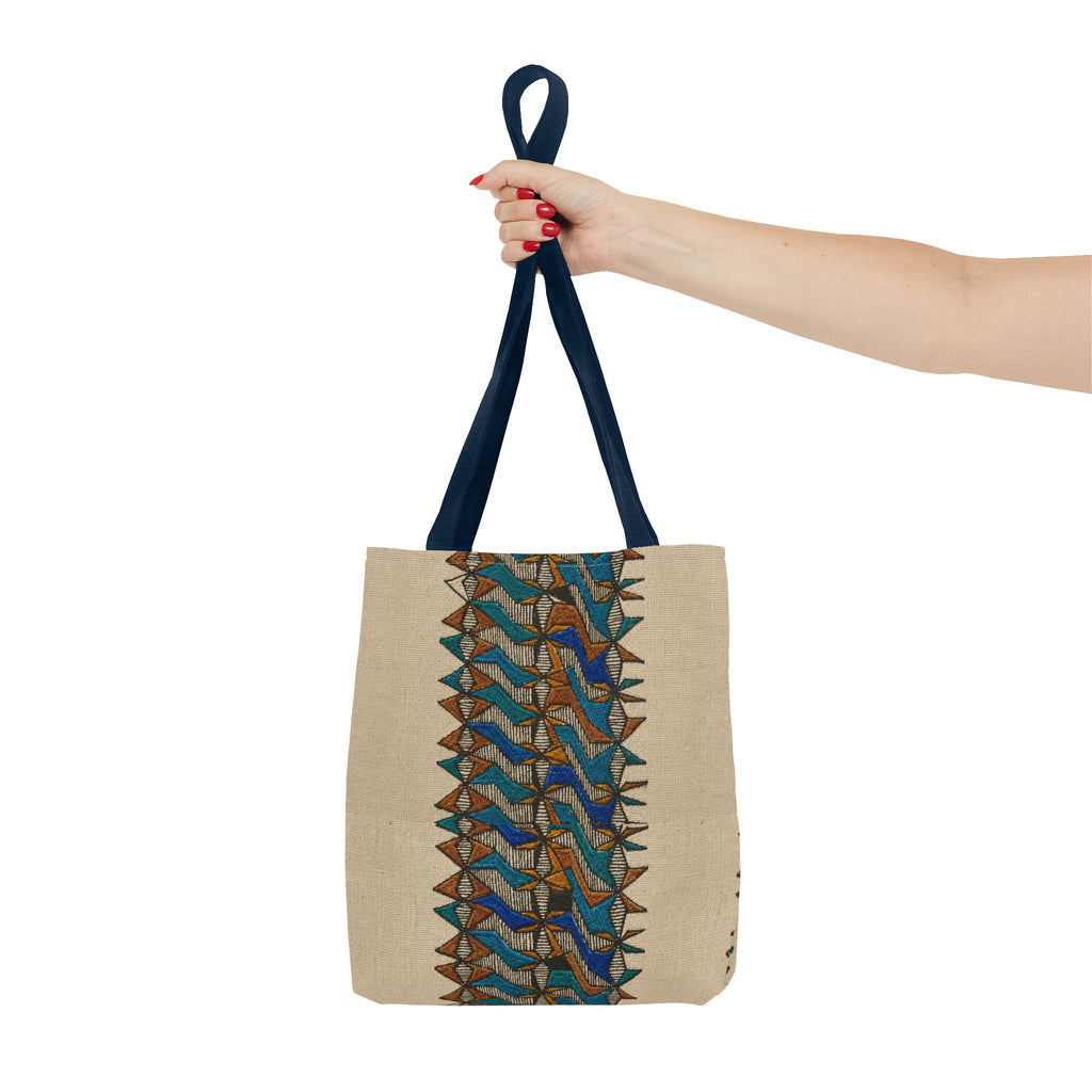 Boho Geometric Everyday Patterned Canvas Tote Bag With Reinforced Handles, 3 Sizes, held by hand with navy handles and a blue and tan geometric pattern. Patterned canvas tote featuring art tote, beige bag, bohemian bag, boho tote, canvas tote, eco shopping, everyday tote, gift for her, market bag, neutral tote, printed tote, summer tote, and tribal tote design.