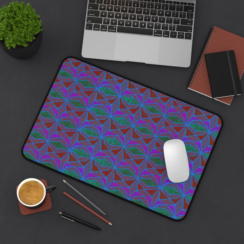 Geometric Neon Wave Desk Mat — Retro Purple & Teal Gamer Desk Pad, angled gaming desk mat lifestyle view with laptop, mouse, notebooks, and coffee.