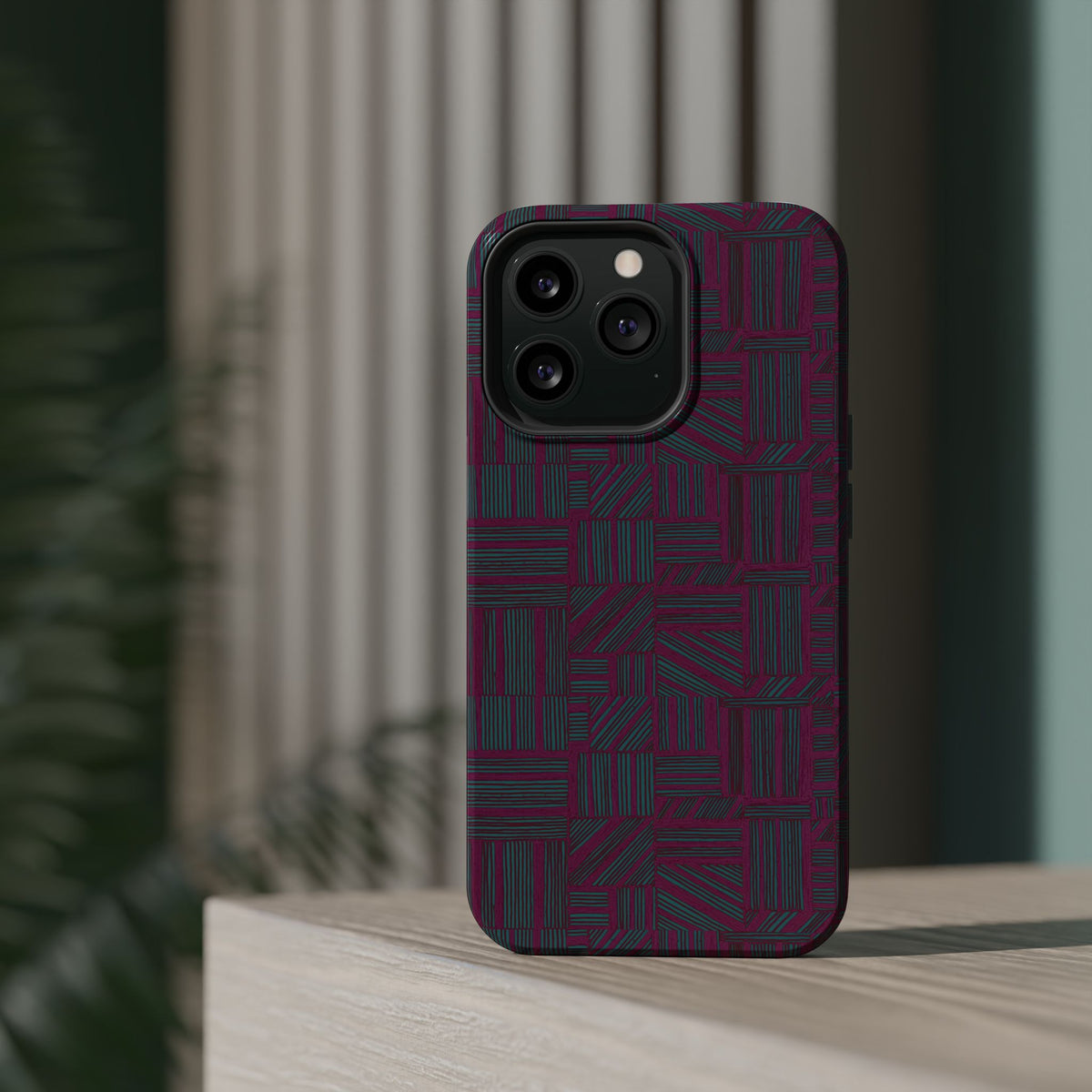 Slim Protective Phone Case With MagSafe, Dual-Layer Impact Protection, Plum Geometric Design, artistic product scene featuring the slim geometric case; slim protective iphone 16 promax  case.