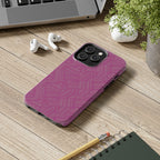 Magenta Geo Pattern Tough Phone Case — Protective Floral-Style Abstract Design, wireless charging iphone 18 pro case displayed beside a notebook and pencil.