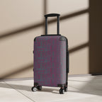 Geometric Plum Carry-On Suitcase – Stylish Patterned Rolling Luggage, angled view of an expandable carry on suitcase in warm indoor light showing its patterned hard shell and smooth spinner wheels.