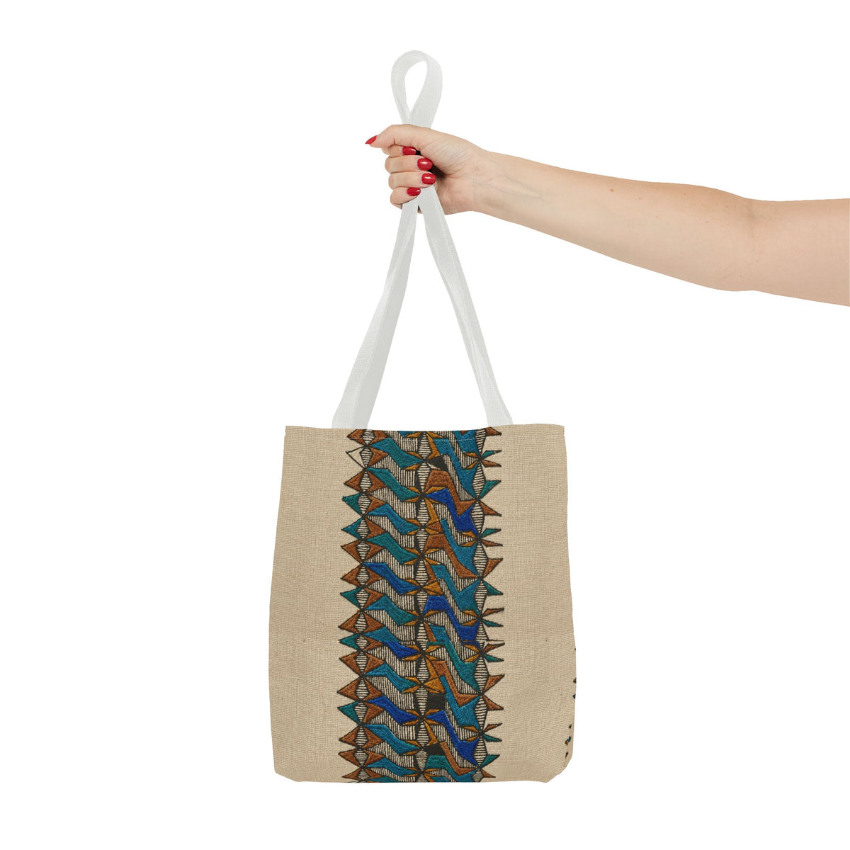 Boho Geometric Everyday Patterned Canvas Tote Bag With Reinforced Handles, 3 Sizes, held by hand with white handles and a blue and tan geometric design. Patterned canvas tote with art tote, beige bag, bohemian bag, boho tote, canvas tote, eco shopping, everyday tote, gift for her, market bag, neutral tote, printed tote, summer tote, and tribal tote styling.