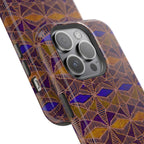 Phone Case — Geometric Tribal Pattern Magnetic Impact-Resistant Case, Fractyl impact resistant iphone 16 pro case standing on a tabletop with bold purple and amber artwork.