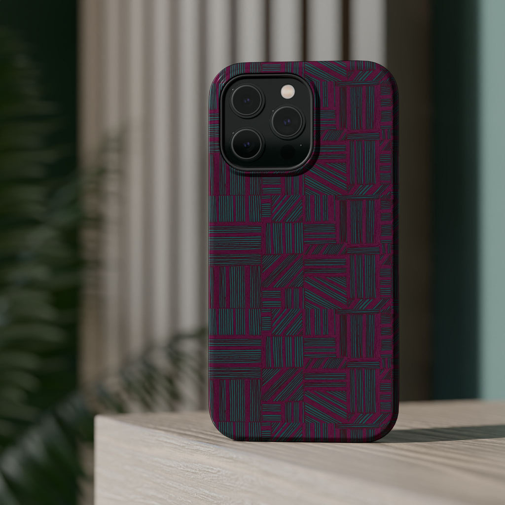 Slim Protective Phone Case With MagSafe, Dual-Layer Impact Protection, Plum Geometric Design, artistic lifestyle render of a protected phone against a dark teal background; slim protective iphone 16 promax  case.
