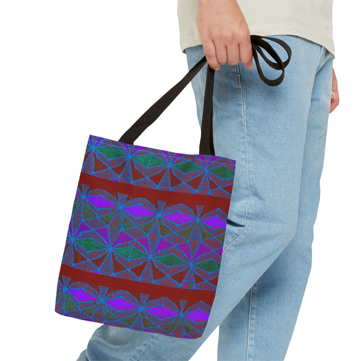 Geometric Heart Pattern Tote Bag — Vintage Tribal All-Over Print, model carrying a colorful geometric canvas tote bag with black handles