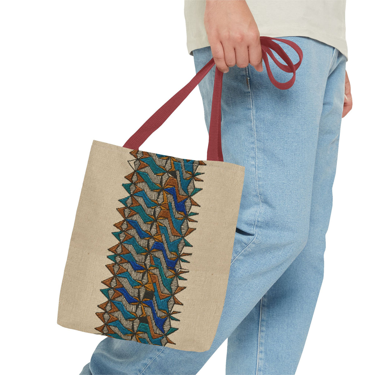 Boho Geometric Everyday Patterned Canvas Tote Bag With Reinforced Handles, 3 Sizes, carried with red handles beside casual blue jeans. This patterned canvas tote combines art tote, beige bag, bohemian bag, boho tote, canvas tote, eco shopping, everyday tote, gift for her, market bag, neutral tote, printed tote, summer tote, and tribal tote appeal.
