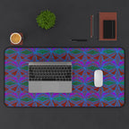 Geometric Neon Wave Desk Mat — Retro Purple & Teal Gamer Desk Pad, extra-wide gaming desk mat shown beneath a laptop and mouse in a workspace setup.