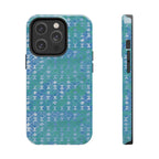 Tough Phone Case — Blue-Green Geometric Watercolor Pattern, shockproof iphone 17 pro case displayed beside laptop and earbuds