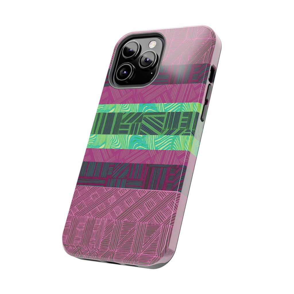 Fractyl glossy protective iphone 18 pro max case, Geometric Stripes Tough Phone Case — Purple & Teal Tribal Pattern, lifestyle view on a wooden desk