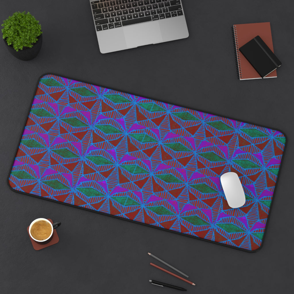 Geometric Neon Wave Desk Mat — Retro Purple & Teal Gamer Desk Pad gaming desk mat lifestyle image featuring a laptop, mouse, coffee, notebooks, and geometric neon print.