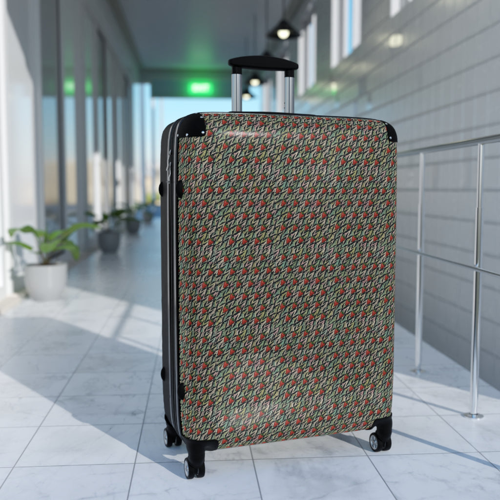 Houndstooth Carry-On Suitcase – Retro Red & Green Patterned Travel Luggage, hard shell carry on displayed upright in a modern airport hallway