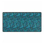 Geometric Teal Desk Mat — Large Patterned Mousepad for Office & Gaming, gaming desk mat shown from above with a bold teal and deep navy geometric pattern and stitched edges