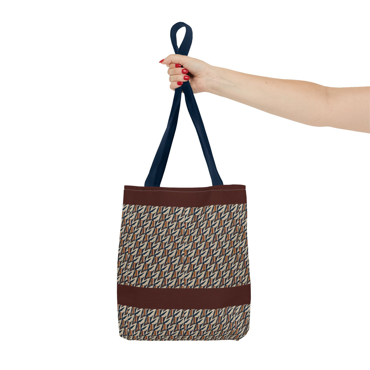 Geometric Retro Stripe Tote Bag – Vintage Brown Patterned AOP Tote held by hand with navy handles, large everyday cotton tote