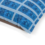 Close-up of the Blue Grid Plush Pet Bed by Printify, showcasing its plush coral fleece and durable cotton duck underside, highlighting its quality as a waterproof dog bed.