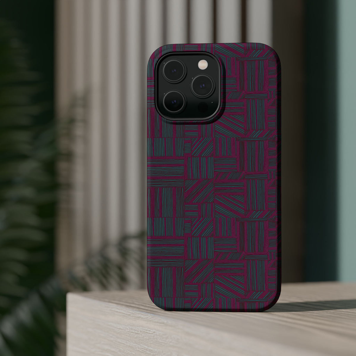 Slim Protective Phone Case With MagSafe, Dual-Layer Impact Protection, Plum Geometric Design, lifestyle render showing the plum case floating among geometric objects; slim protective iphone 16 promax  case.