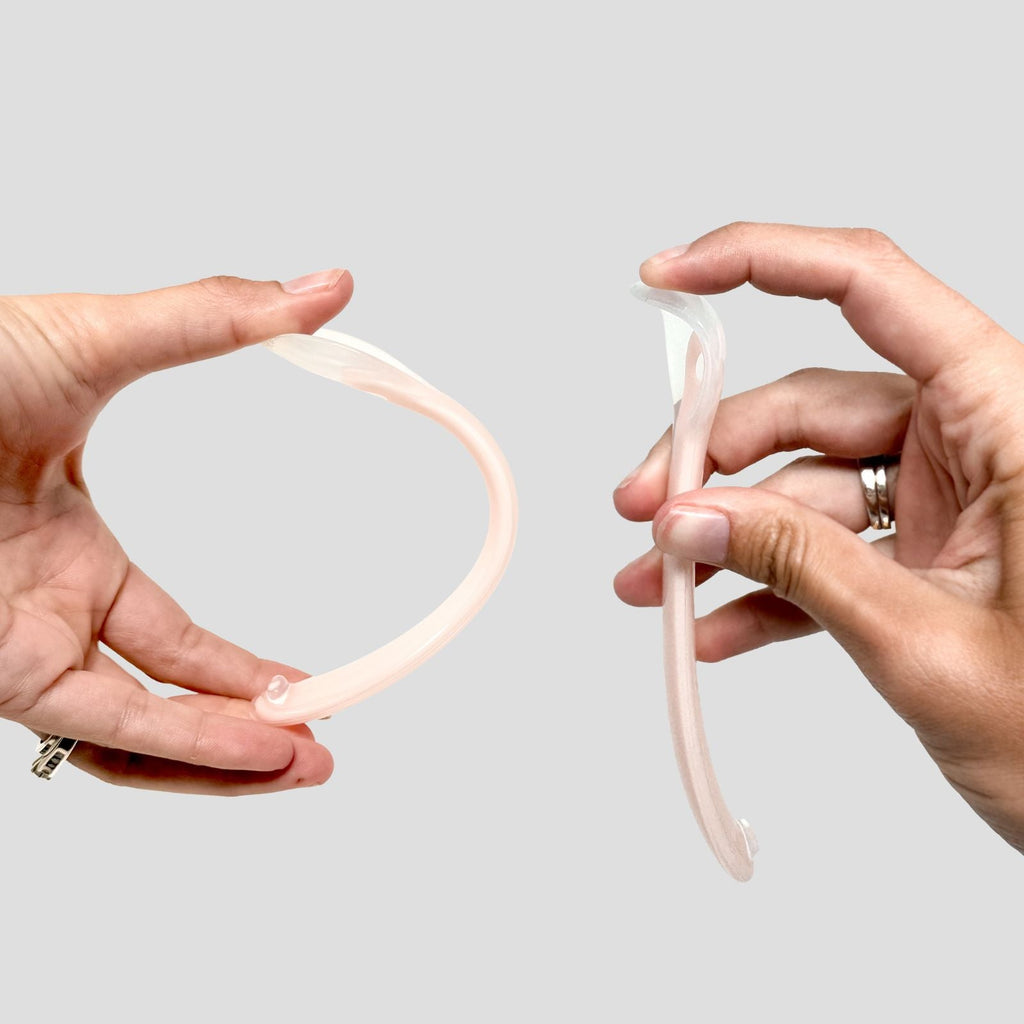 Hands demonstrating the flexible silicone spoon from the Bite Size Bundle Baby's Brew toddler feeding set