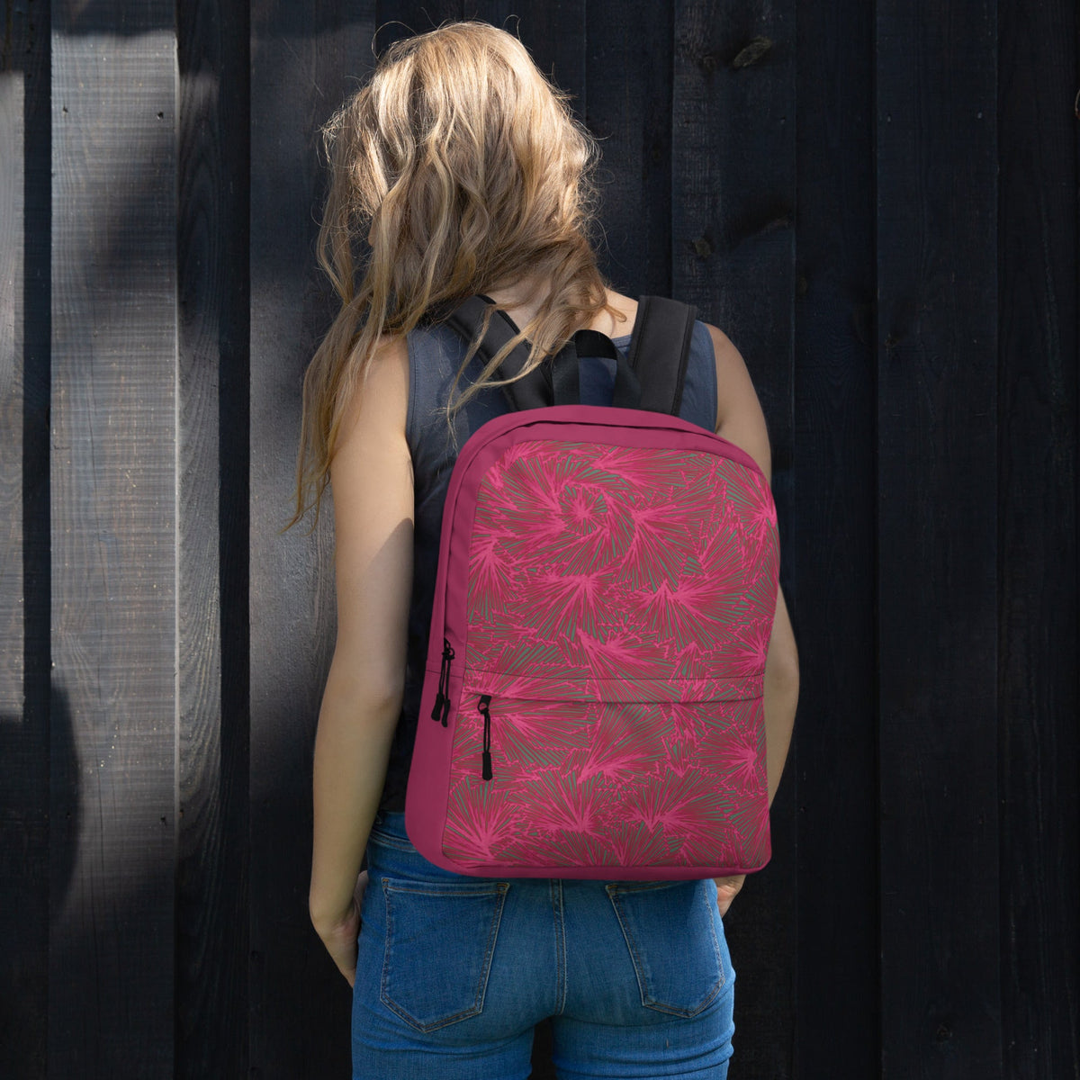 Back view of a stylish pink backpack with floral design, showcasing its sleek shape. A must-have apple back to school bag pack for fashionable students.