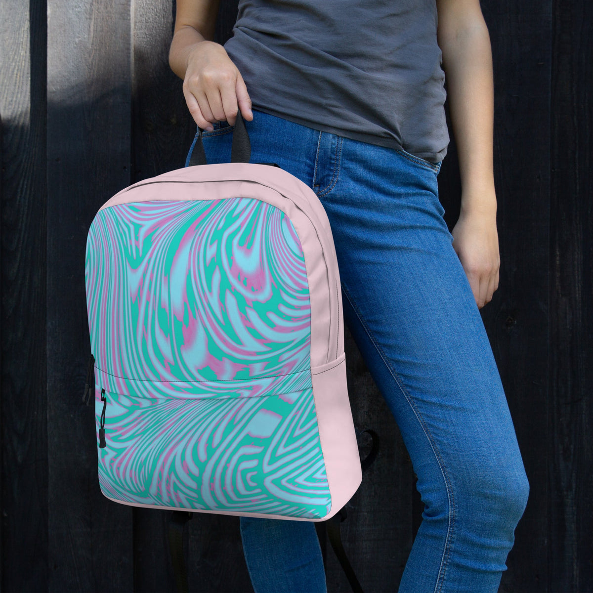Close-up of a woman holding a trendy pink and green back to school bag packs featuring a spacious design, ideal for carrying essentials.