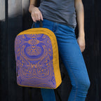Close-up of a decorative backpack held by a model, emphasizing style and functionality for go back to school.