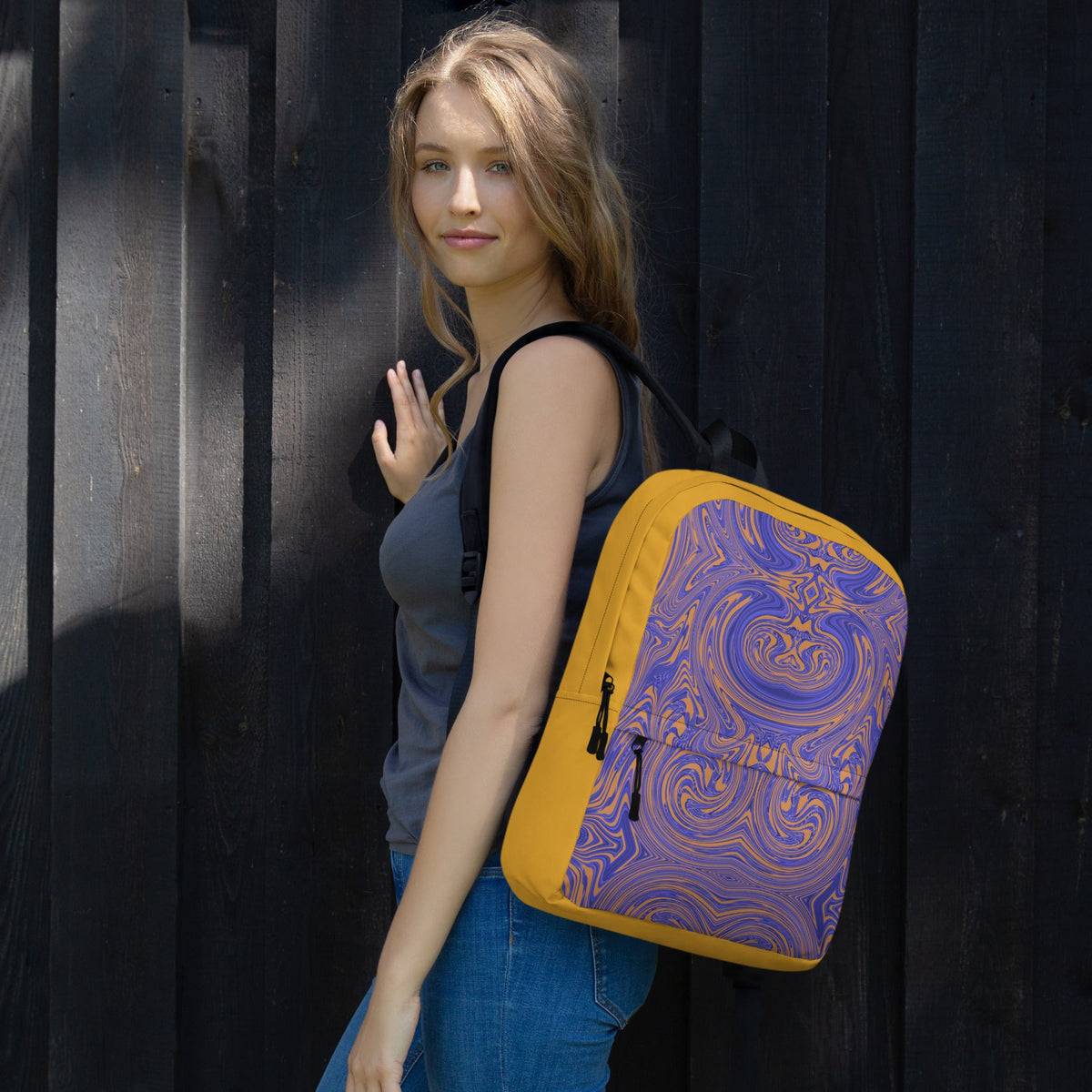 Stylish backpack featuring a vibrant design, perfect for back to school use, worn by a model outdoors.