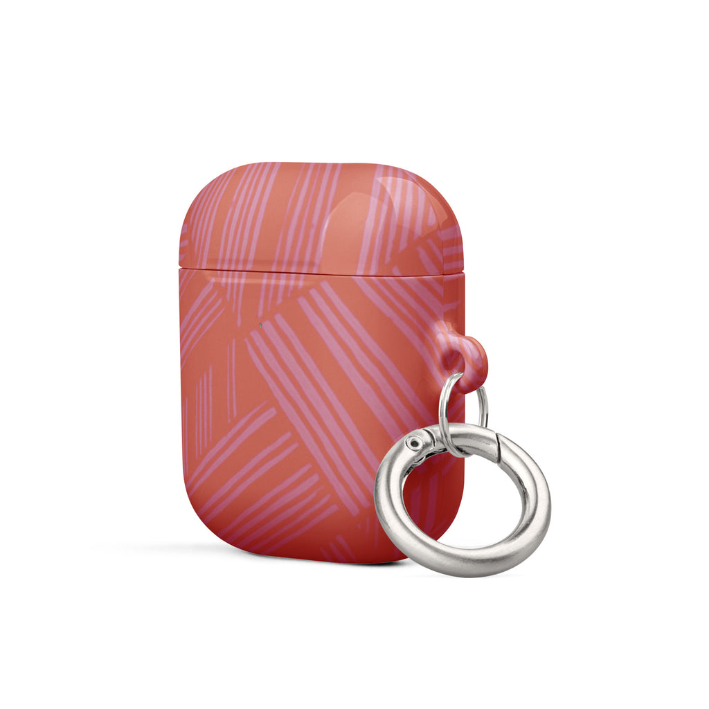 Angled view of the coral Case for AirPods® featuring a protective polycarbonate shell and metal carabiner; stylish airpods gen 2 case with carabiner.