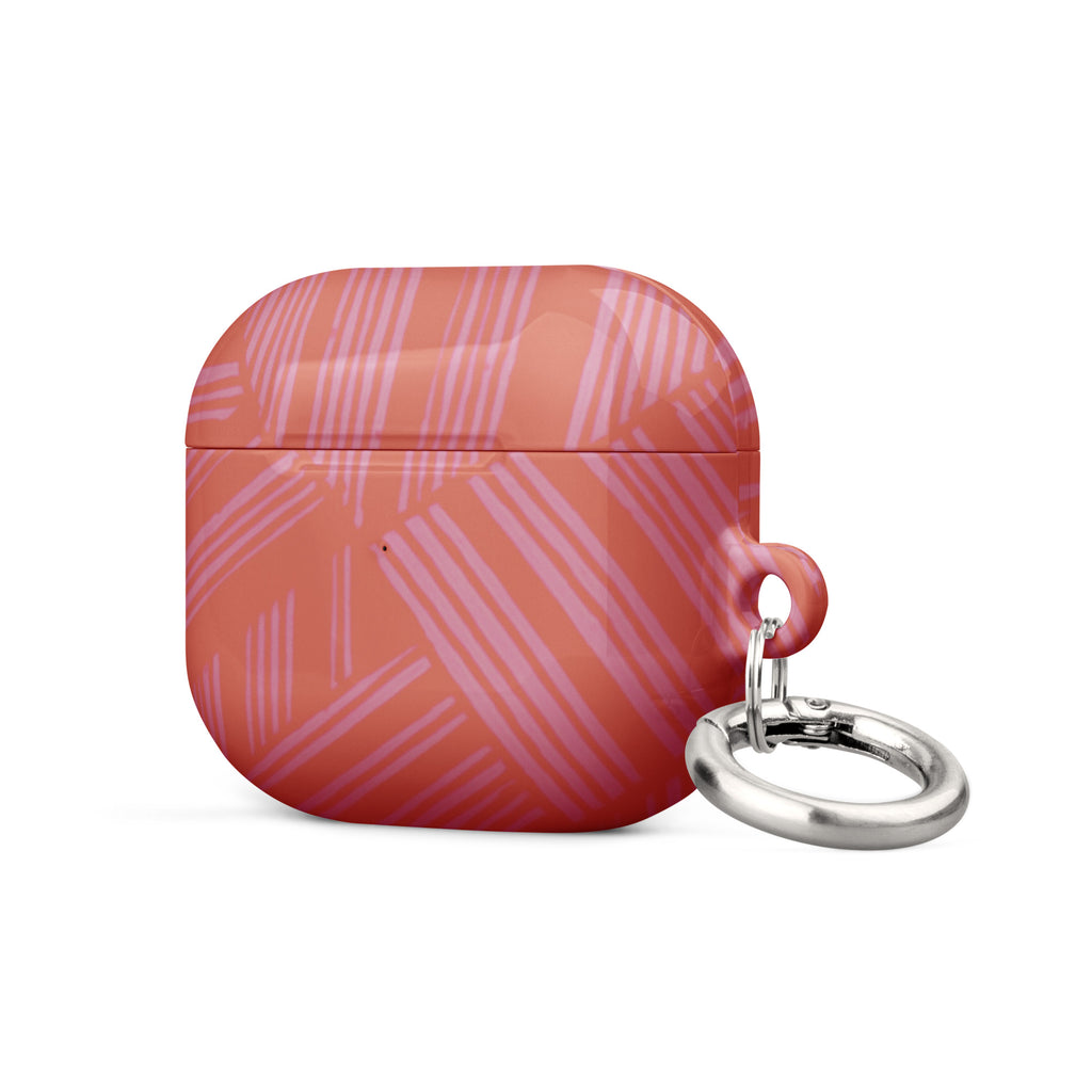 Side view of the closed coral geometric Case for AirPods® with metal carabiner resting beside it; compact airpods gen 2 case with carabiner.