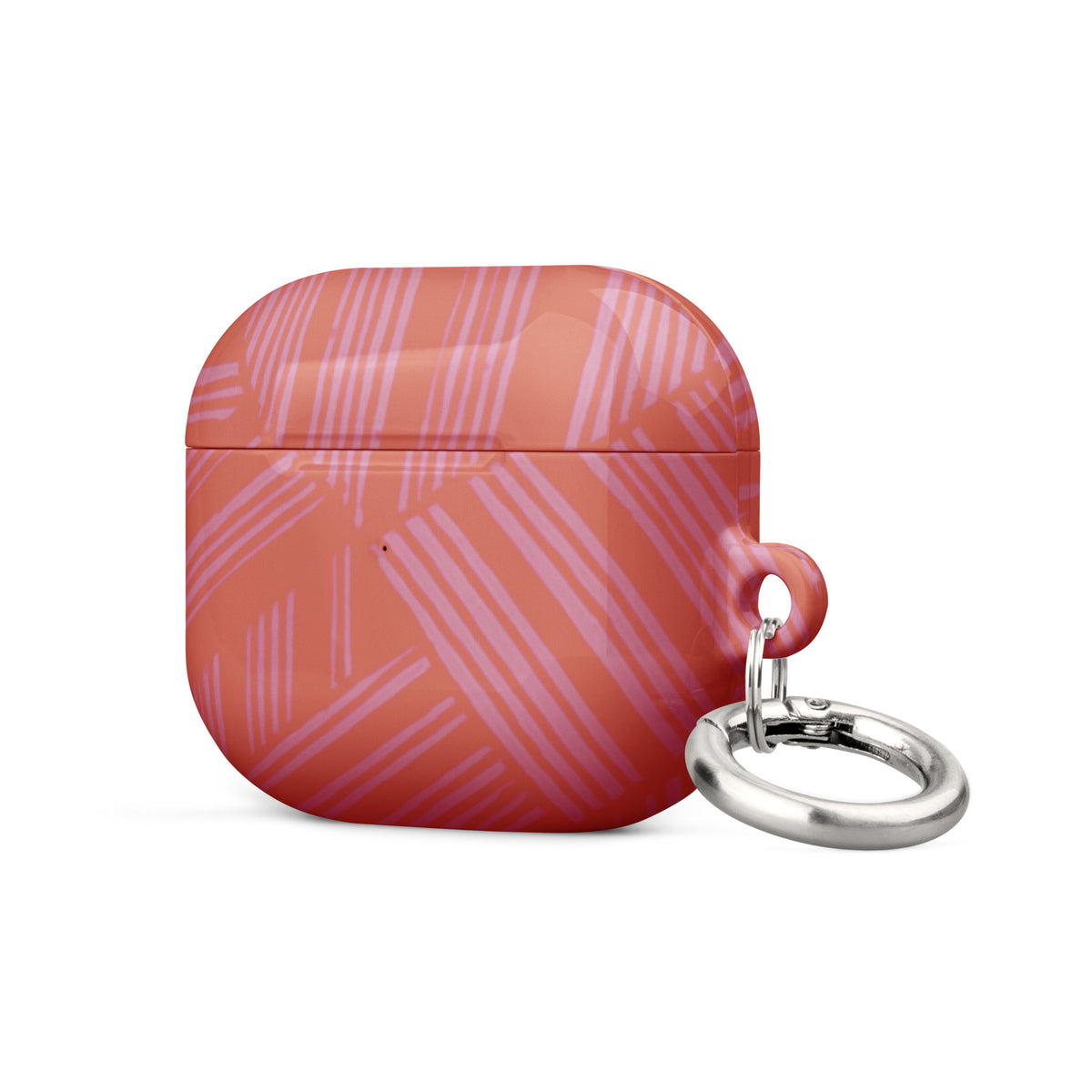Side view of the closed coral geometric Case for AirPods® with metal carabiner resting beside it; compact airpods gen 2 case with carabiner.