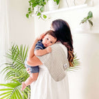 Butterfly Set - Muslin Burp Cloths (4 Pack) absorbent burp cloths for under 2, shown over a mother's shoulder while she carries her child.