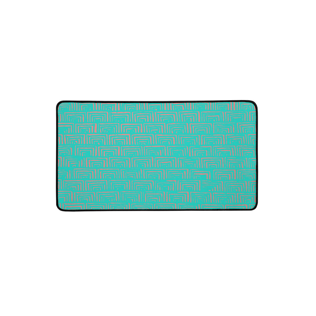 Durable desk mat for gaming showcasing a turquoise geometric pattern, equipped with anti-slip backing to keep your desk organized and clutter-free.