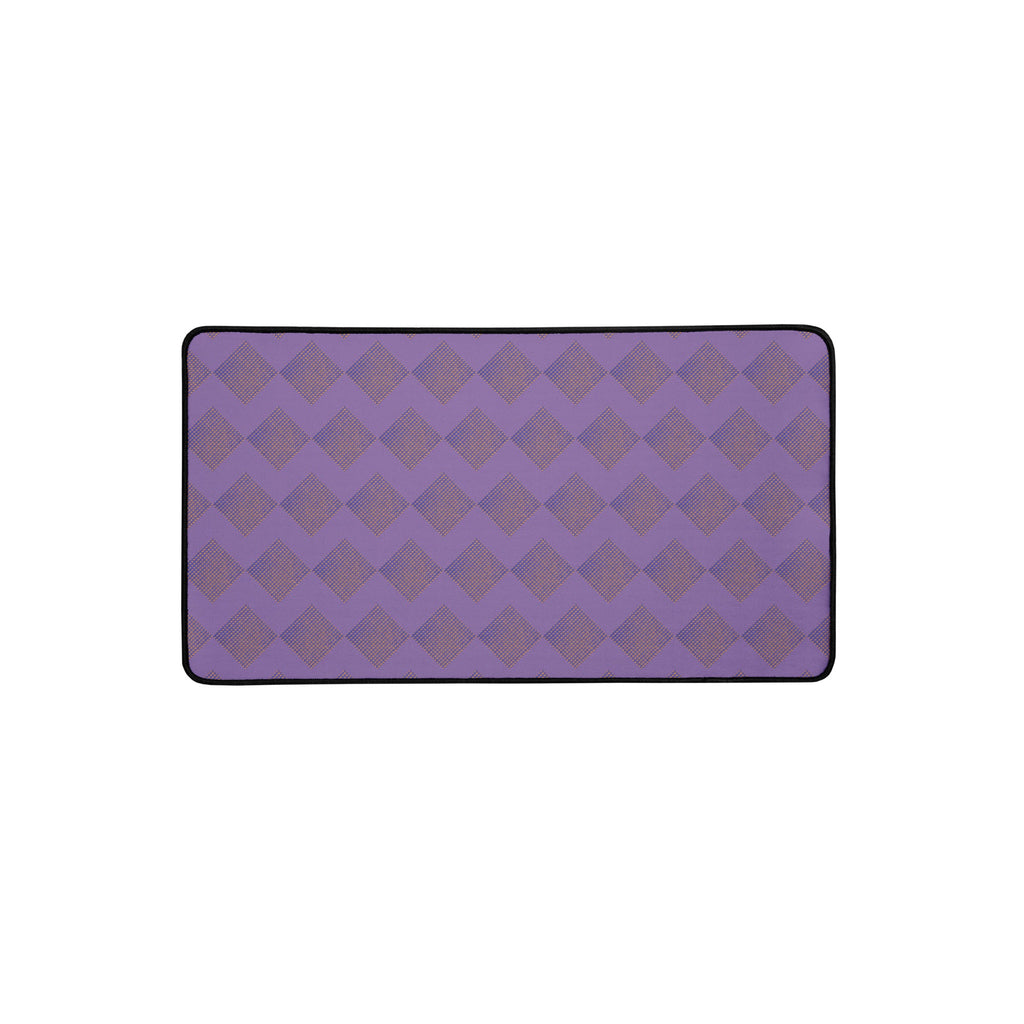 Elegant large desk mat in a vibrant purple hue with diamond motifs, designed to elevate your desk setup.